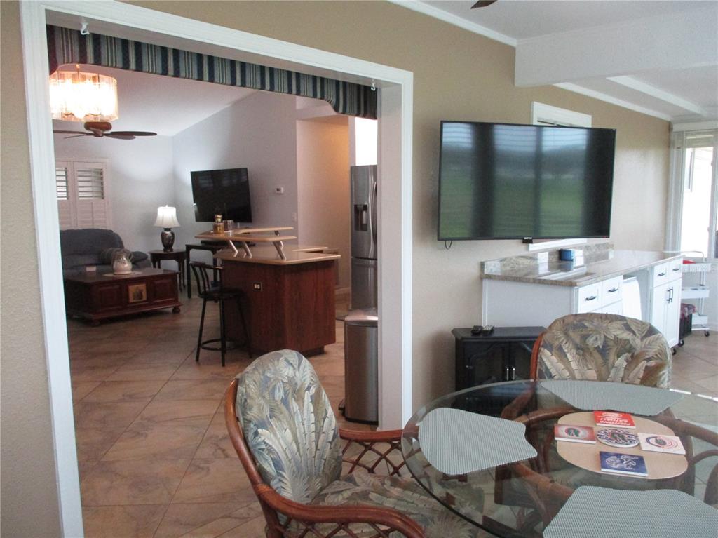 11273 Southwest 136th Place Dunnellon, FL 34432 - Photo 17 of 78 a living room with furniture and a flat screen tv