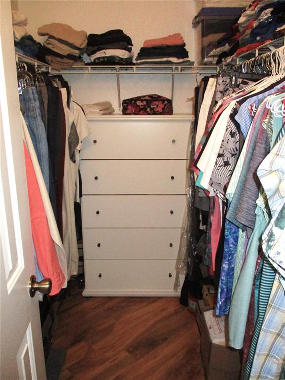 11273 Southwest 136th Place Dunnellon, FL 34432 - Photo 27 of 78 a view of walk in closet with clothes and shoes