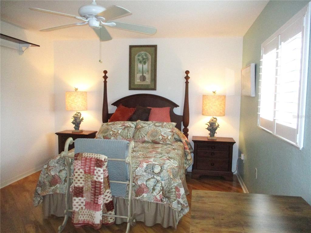 11273 Southwest 136th Place Dunnellon, FL 34432 - Photo 31 of 78 a bedroom with a bed and wooden floor