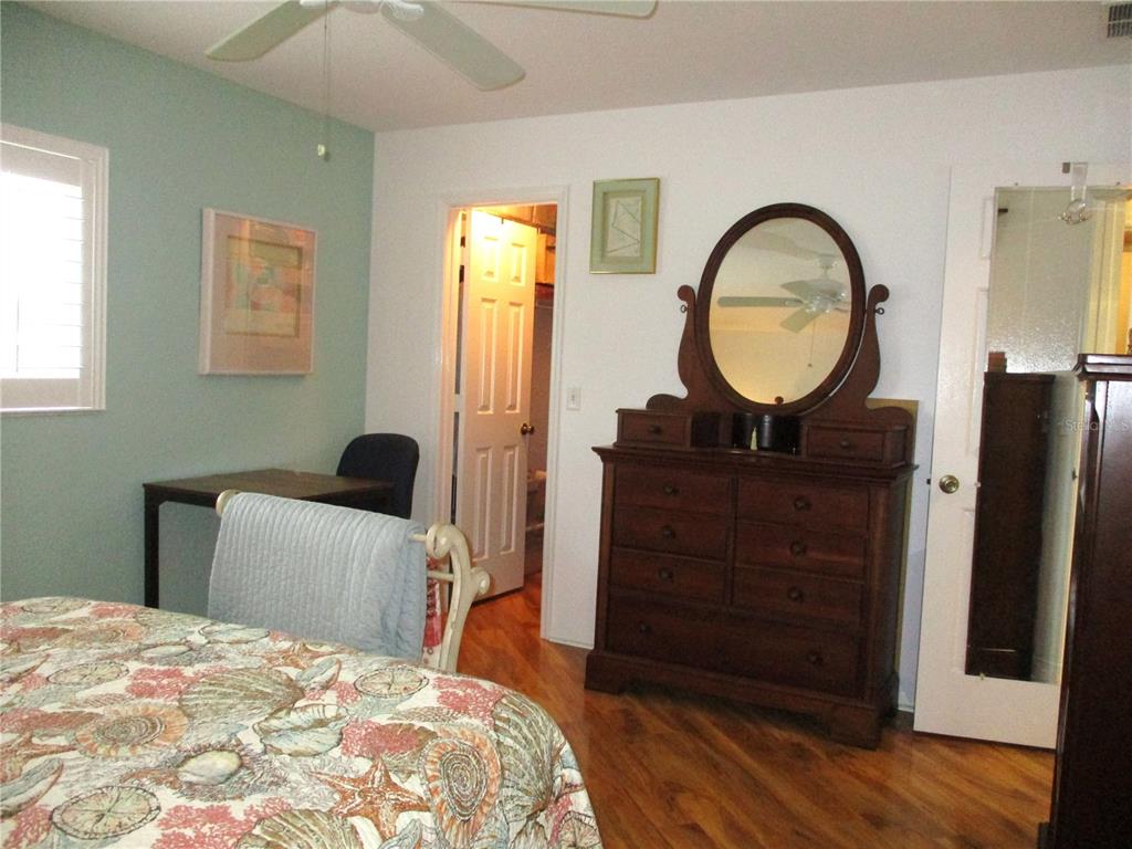 11273 Southwest 136th Place Dunnellon, FL 34432 - Photo 33 of 78 a bedroom with a bed and a dresser