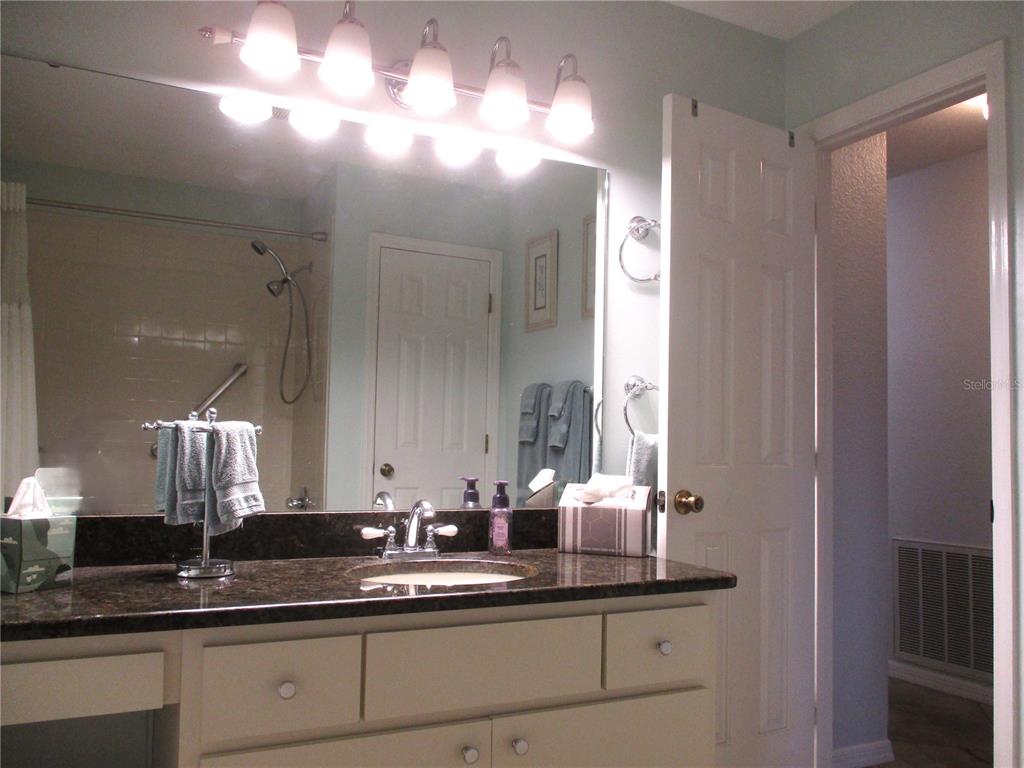 11273 Southwest 136th Place Dunnellon, FL 34432 - Photo 35 of 78 a bathroom with a double vanity sink and a mirror