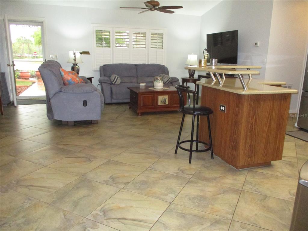 11273 Southwest 136th Place Dunnellon, FL 34432 - Photo 5 of 78 a living room with furniture and a flat screen tv