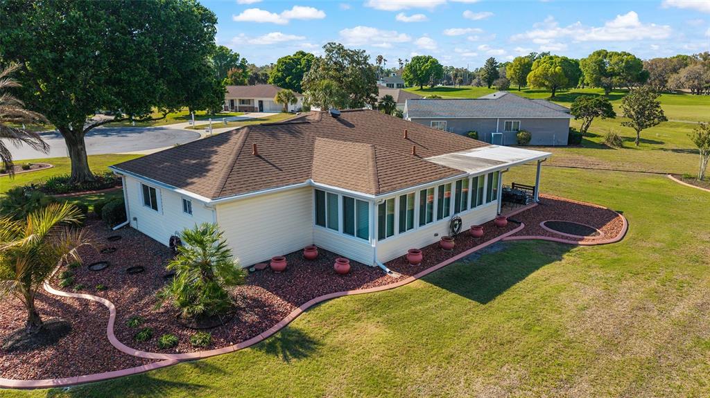 11273 Southwest 136th Place Dunnellon, FL 34432 - Photo 51 of 78 a view of a house with swimming pool and sitting area