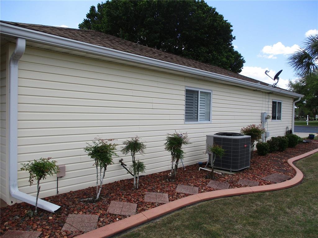 11273 Southwest 136th Place Dunnellon, FL 34432 - Photo 53 of 78 a view of a backyard with plants and outdoor seating