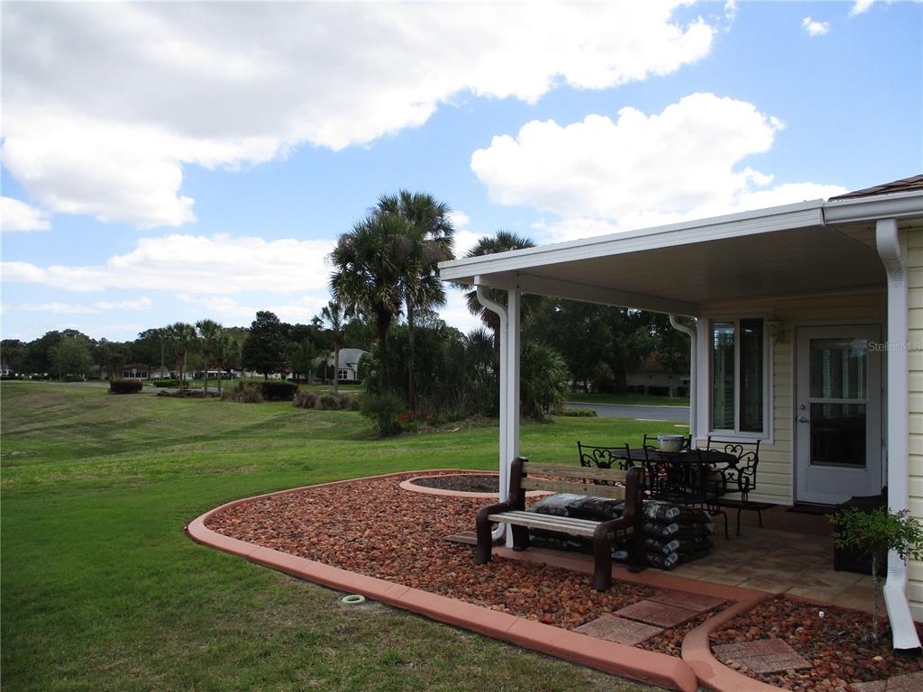 11273 Southwest 136th Place Dunnellon, FL 34432 - Photo 55 of 78 a view of a sitting area and backyard of the house