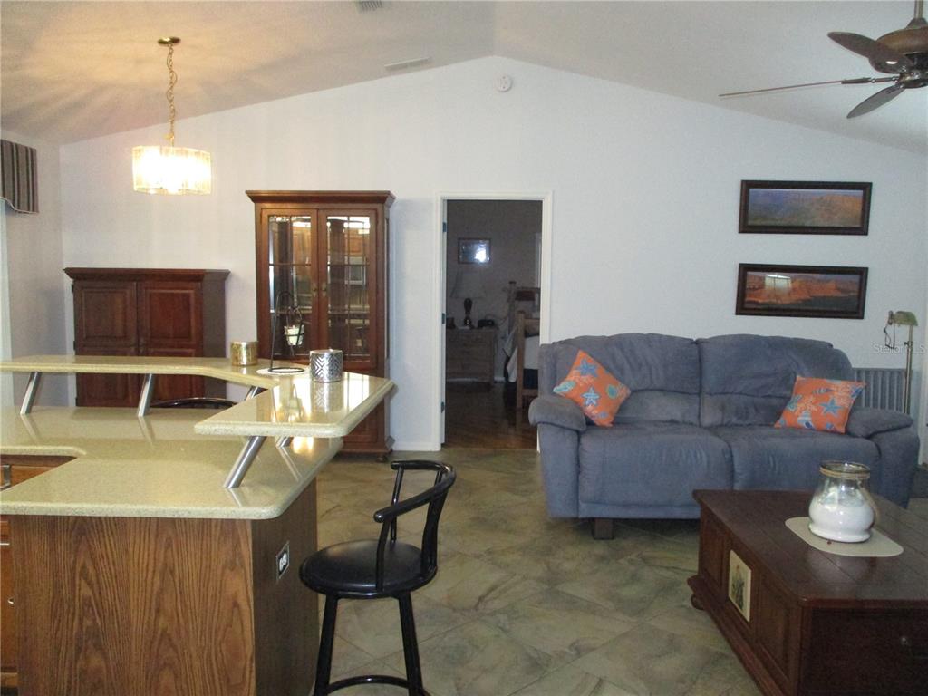 11273 Southwest 136th Place Dunnellon, FL 34432 - Photo 6 of 78 a living room with furniture and a flat screen tv