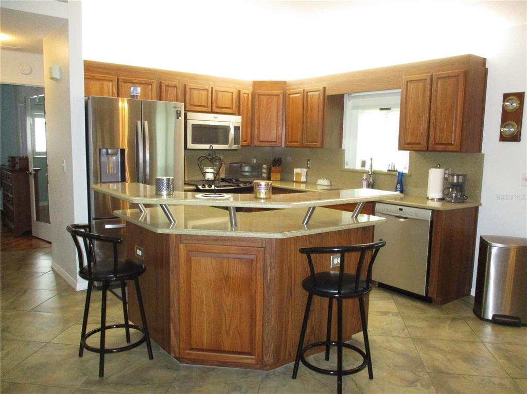 11273 Southwest 136th Place Dunnellon, FL 34432 - Photo 8 of 78 a kitchen with a sink cabinets and window