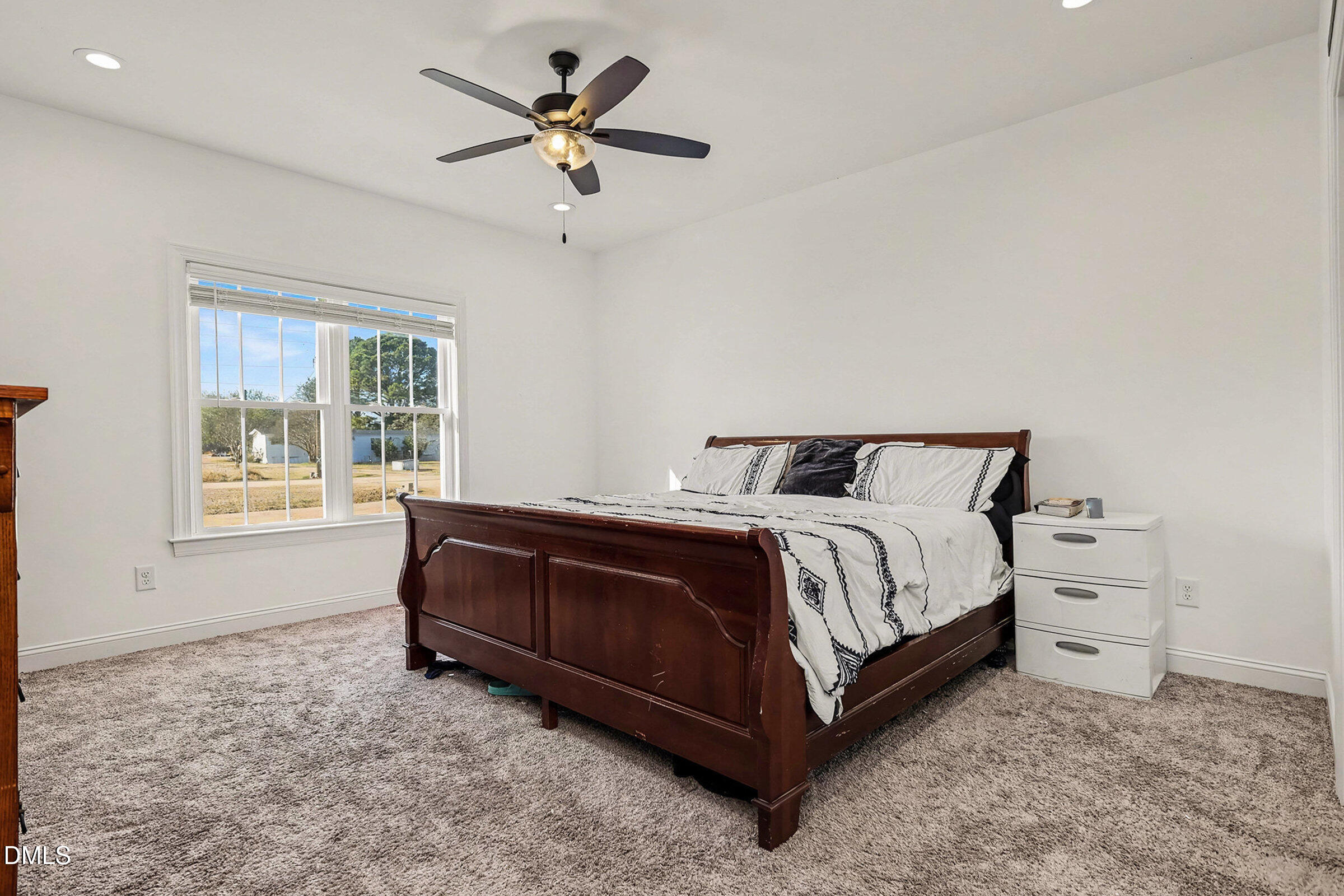 5117 Joe Ellen Road Battleboro, NC 27809 - Photo 15 of 23 a spacious bedroom with a bed and a window