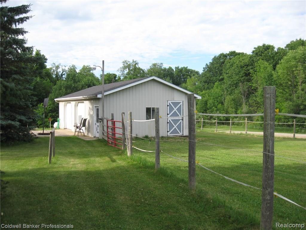 1430 West Brocker Road Metamora, MI 48455 - Photo 7 of 34 Fenced pasture attached to garage/horse stall.
