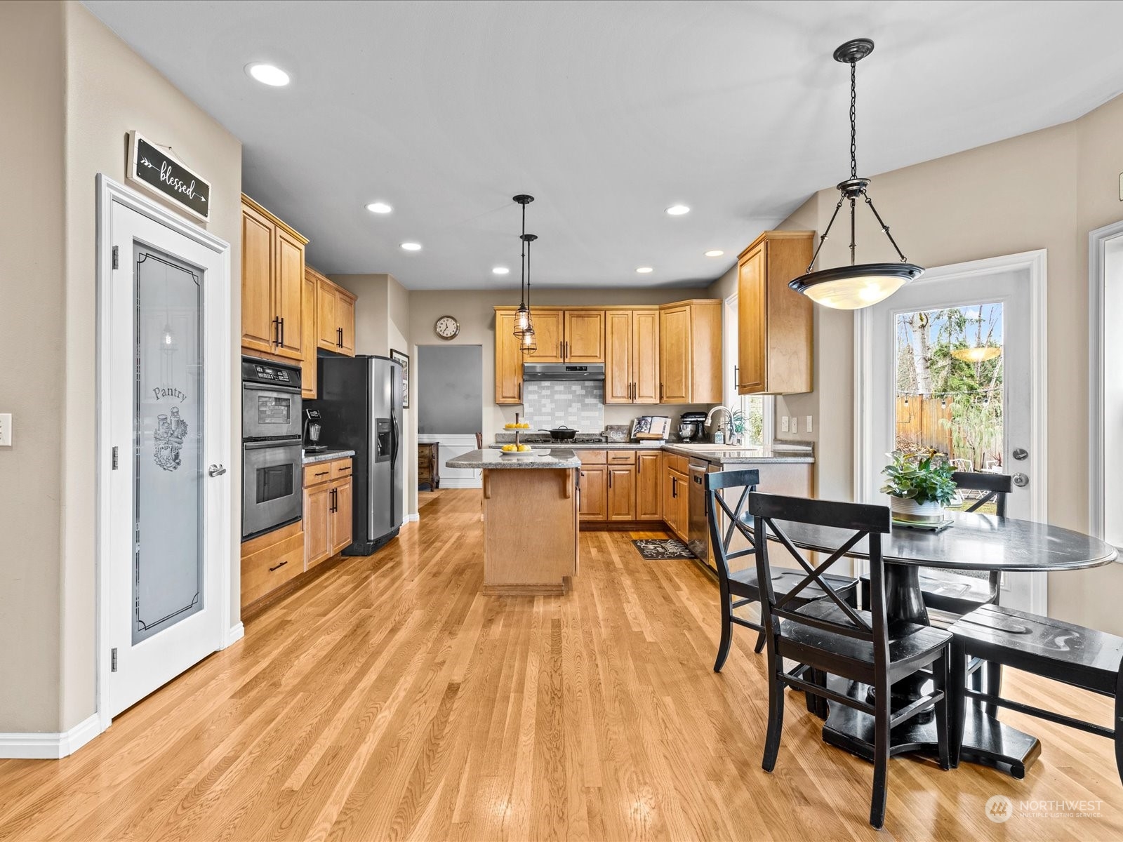 9506 Northeast 191st Street Bothell, WA 98011 - Photo 20 of 40 a view of a kitchen and dining room