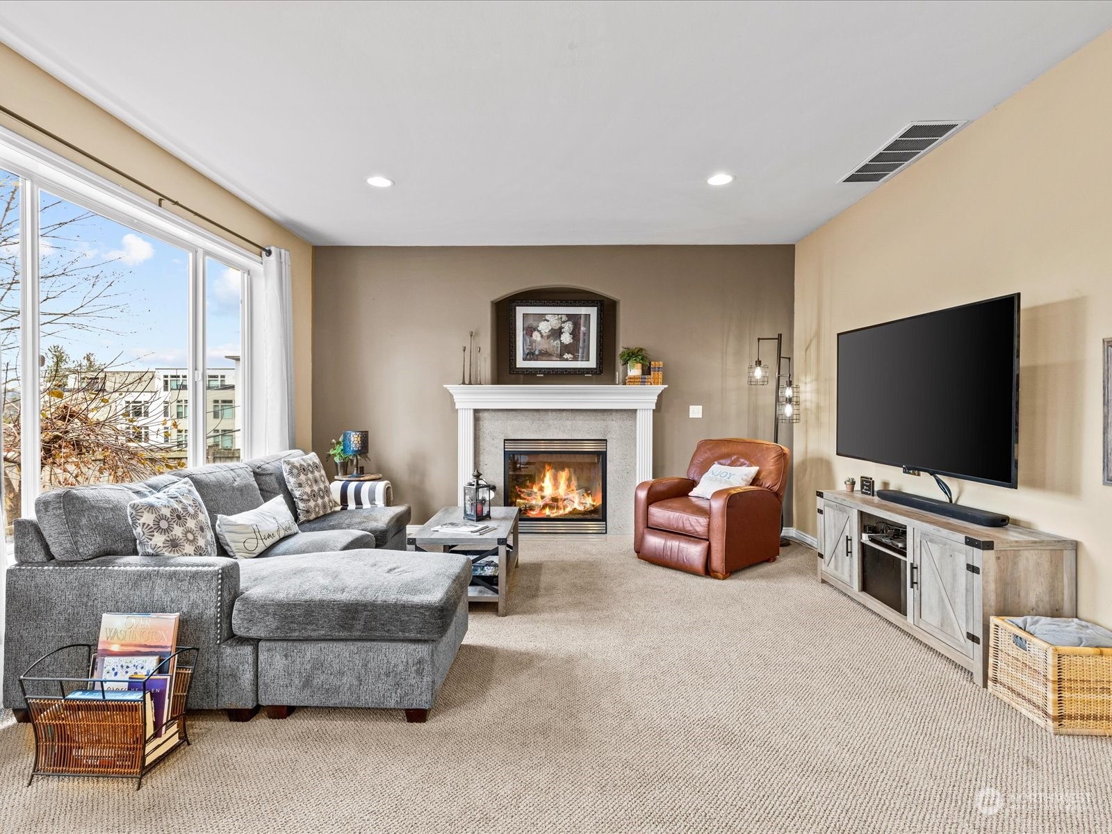 9506 Northeast 191st Street Bothell, WA 98011 - Photo 21 of 40 a living room with furniture and a flat screen tv