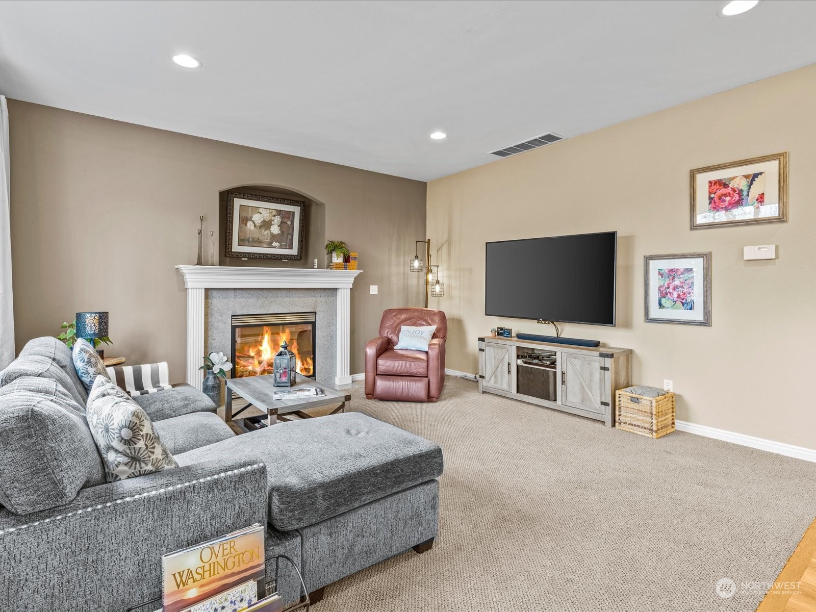 9506 Northeast 191st Street Bothell, WA 98011 - Photo 22 of 40 a living room with furniture and a flat screen tv