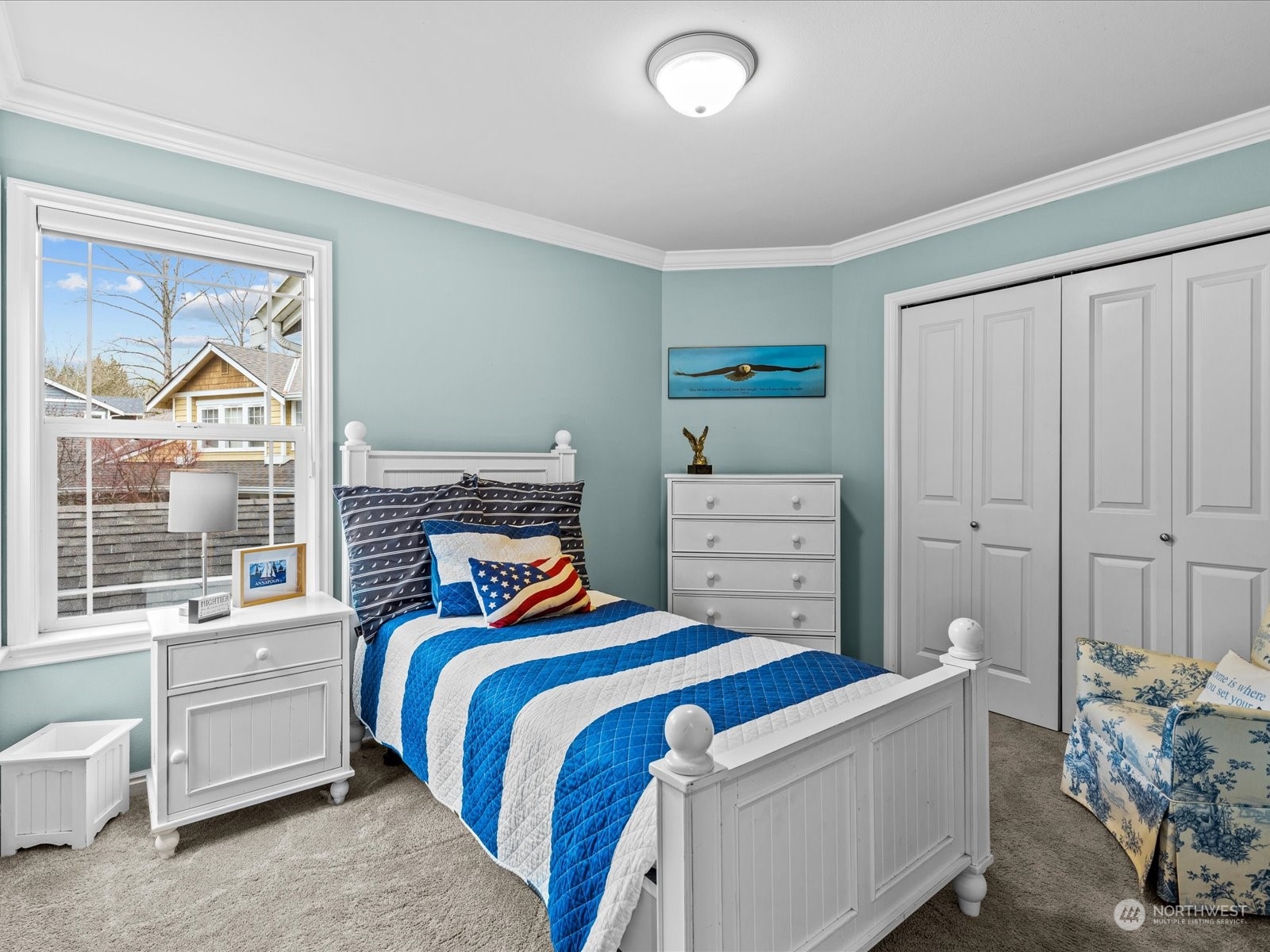 9506 Northeast 191st Street Bothell, WA 98011 - Photo 31 of 40 a bedroom with a bed and a painting on the wall