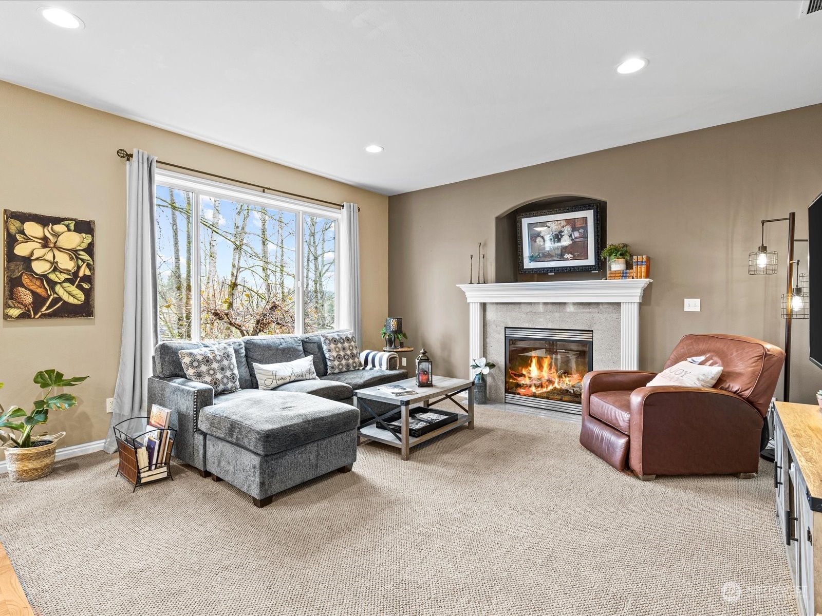 9506 Northeast 191st Street Bothell, WA 98011 - Photo 5 of 40 a living room with furniture and a fireplace
