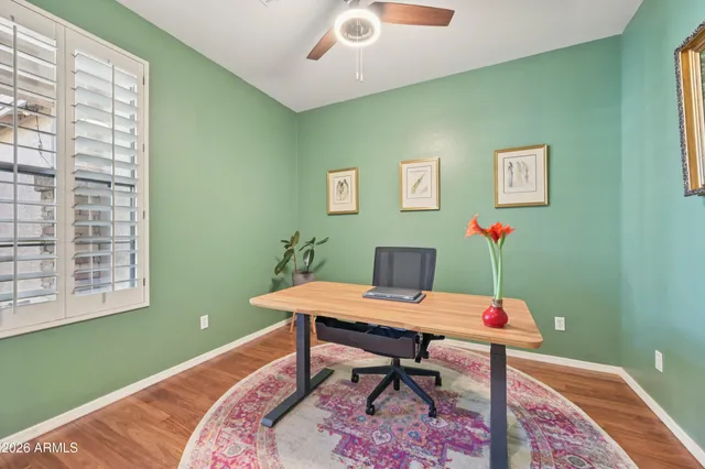 a bedroom with a large bed and a large window