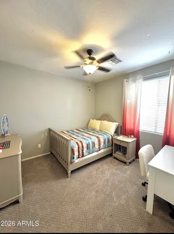 a bathroom with a double vanity sink toilet and a mirror