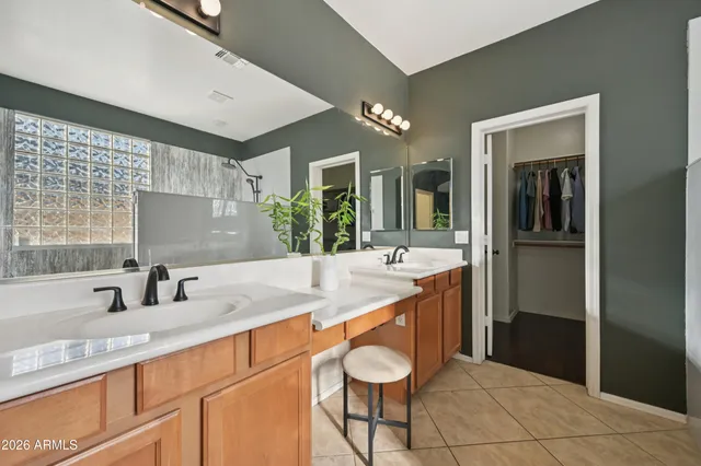 a view of house with backyard and outdoor seating