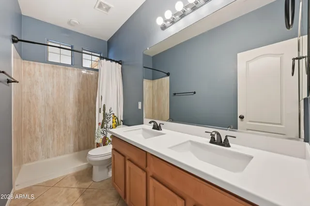 a living room with furniture and windows