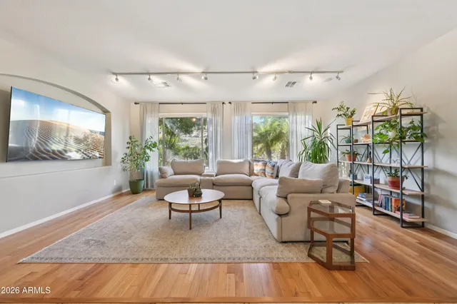 a living room with furniture and a large window