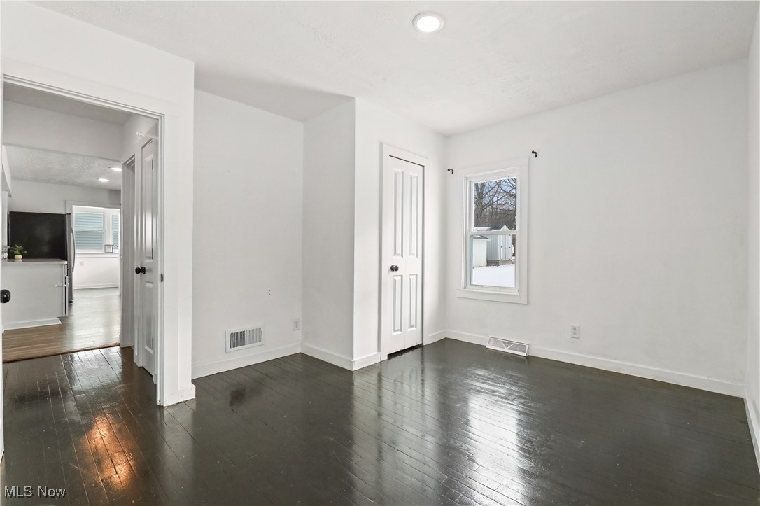 34549 Detroit Road Avon, OH 44011 - Photo 24 of 50 1st floor Bedroom with plenty of natural light, dark wood flooring, and recessed lighting