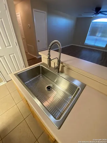 a view of kitchen island with a sink