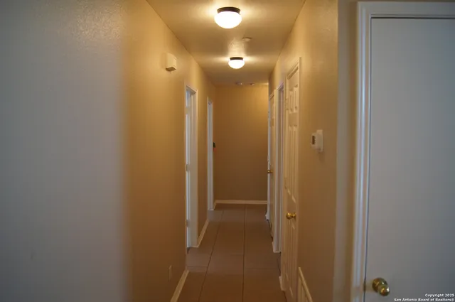 a view of a bathroom from a hallway