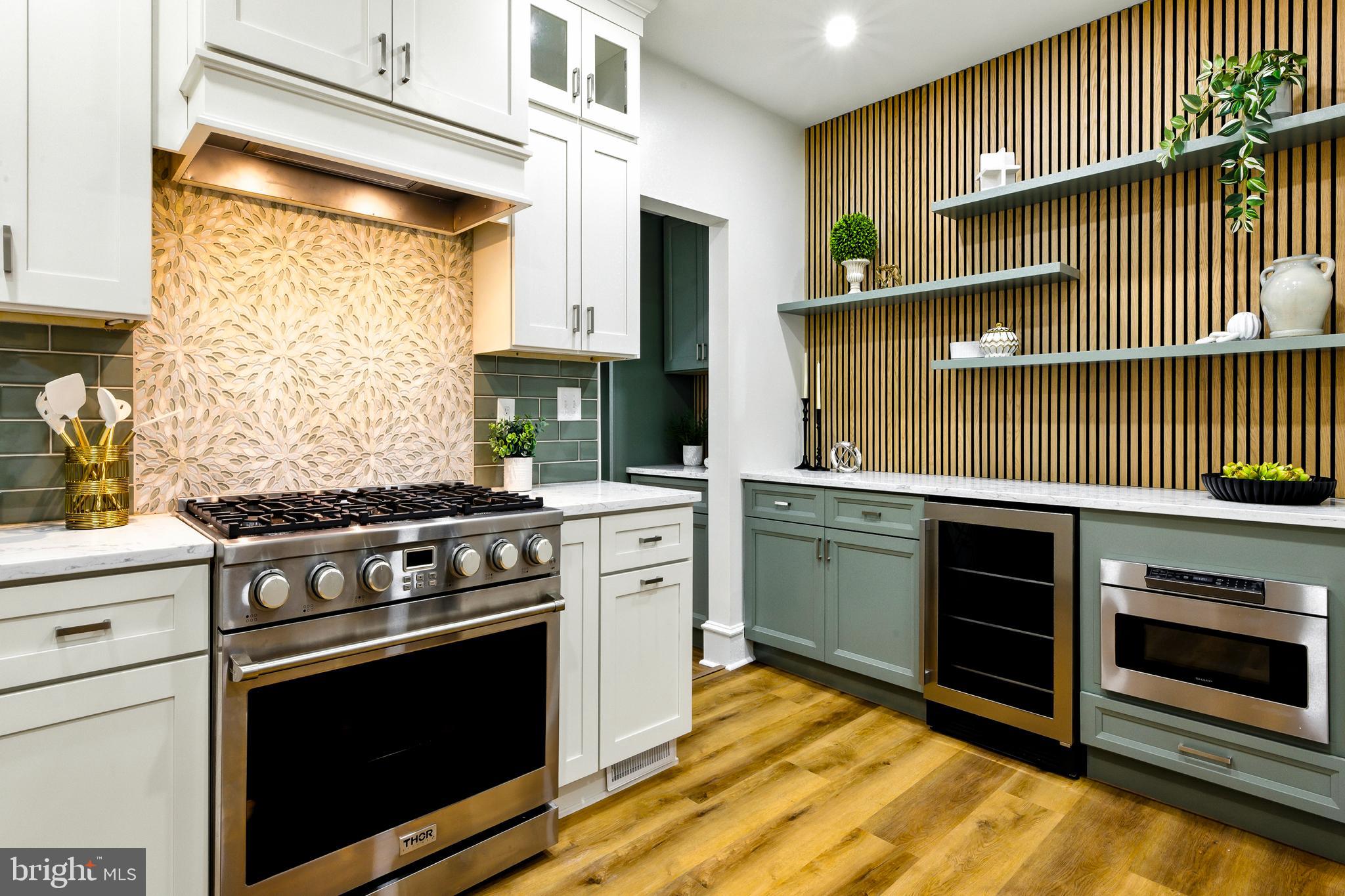 713 Main Street Riverton, NJ 08077 - Photo 1 of 36 a kitchen with a stove and a microwave