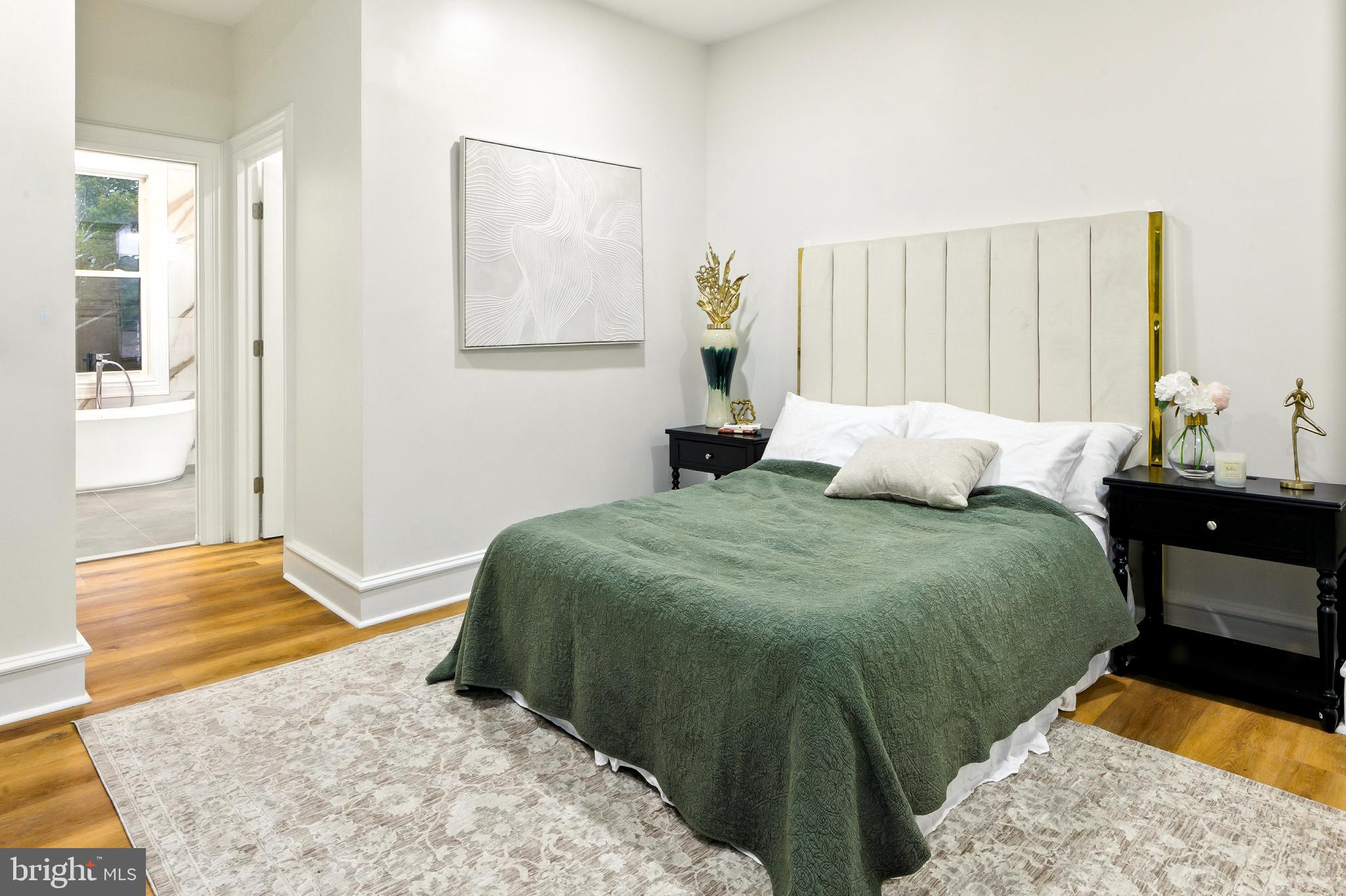713 Main Street Riverton, NJ 08077 - Photo 18 of 36 a bedroom with a bed and wooden floor