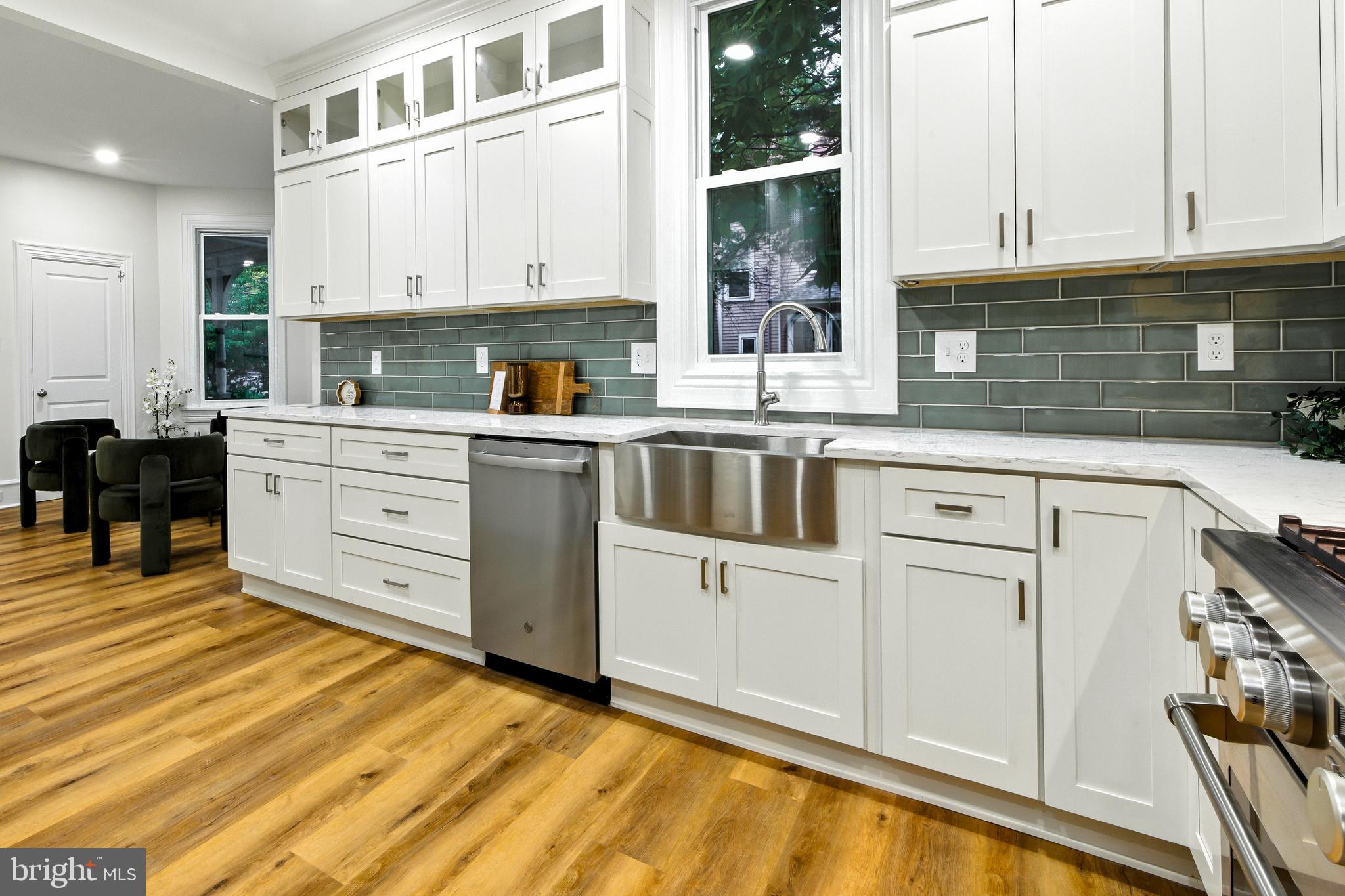 713 Main Street Riverton, NJ 08077 - Photo 2 of 36 a kitchen with white cabinets and sink
