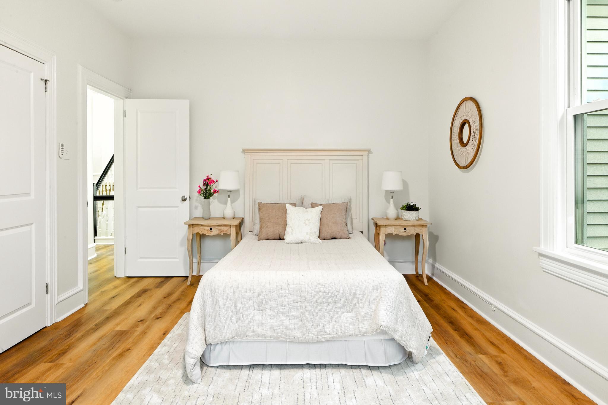 713 Main Street Riverton, NJ 08077 - Photo 26 of 36 a spacious bedroom with a bed and a window