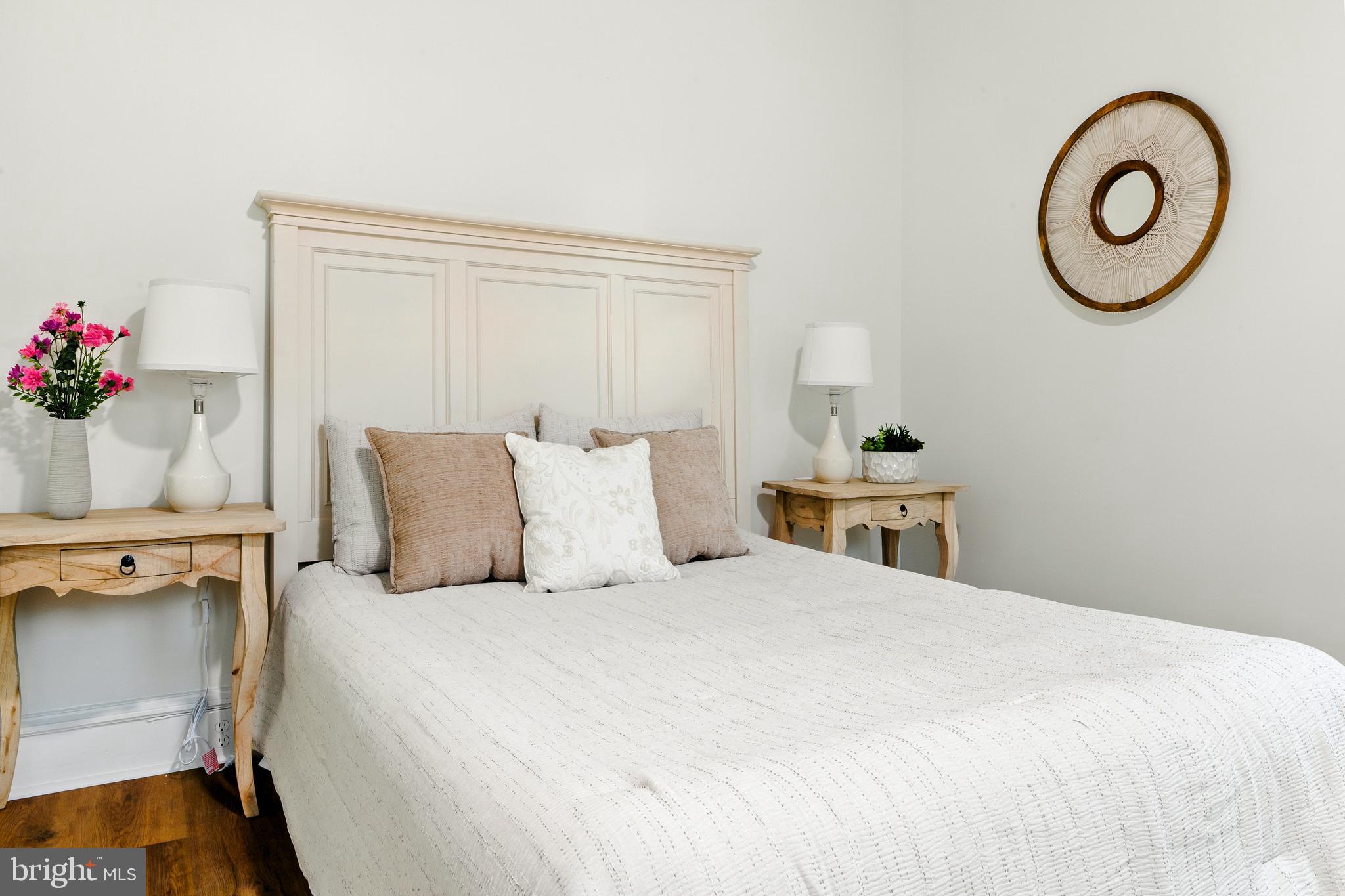 713 Main Street Riverton, NJ 08077 - Photo 27 of 36 a bedroom with a bed and a chandelier