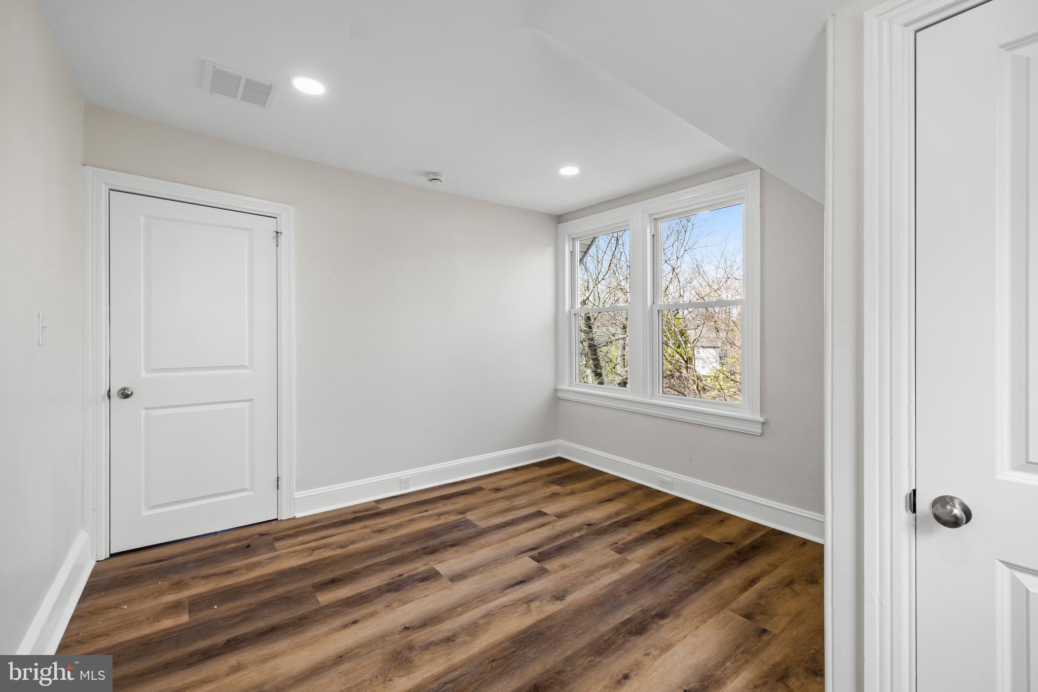 713 Main Street Riverton, NJ 08077 - Photo 28 of 36 a view of an empty room with wooden floor and a window