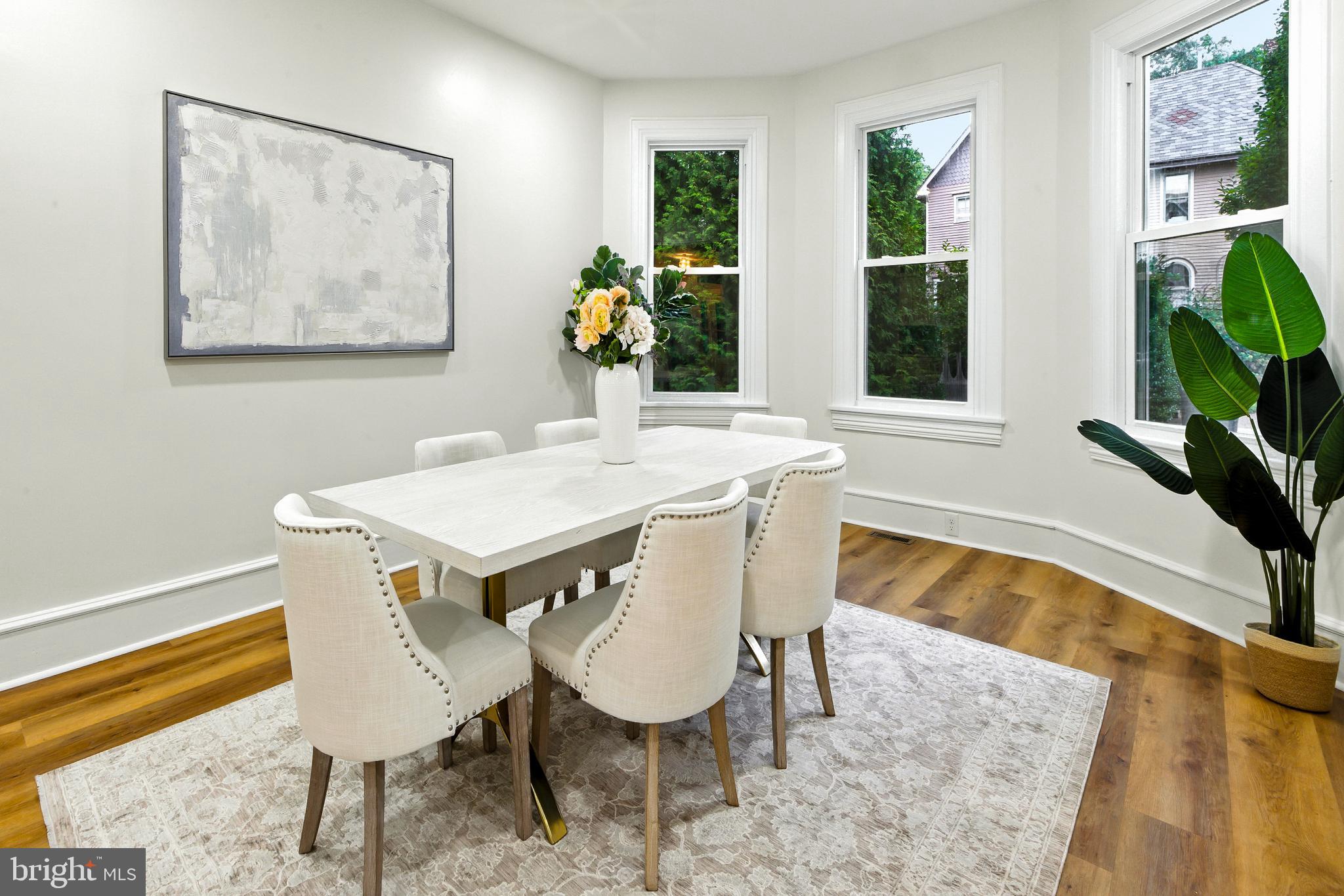 713 Main Street Riverton, NJ 08077 - Photo 4 of 36 a view of a dining room with furniture and a potted plant