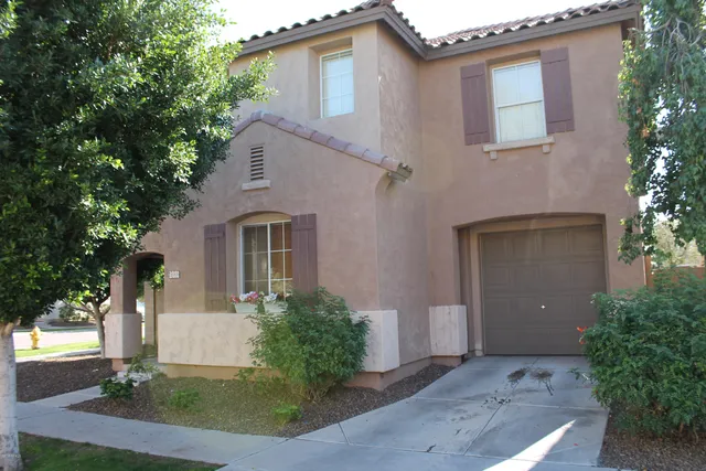 a front view of a house with yard