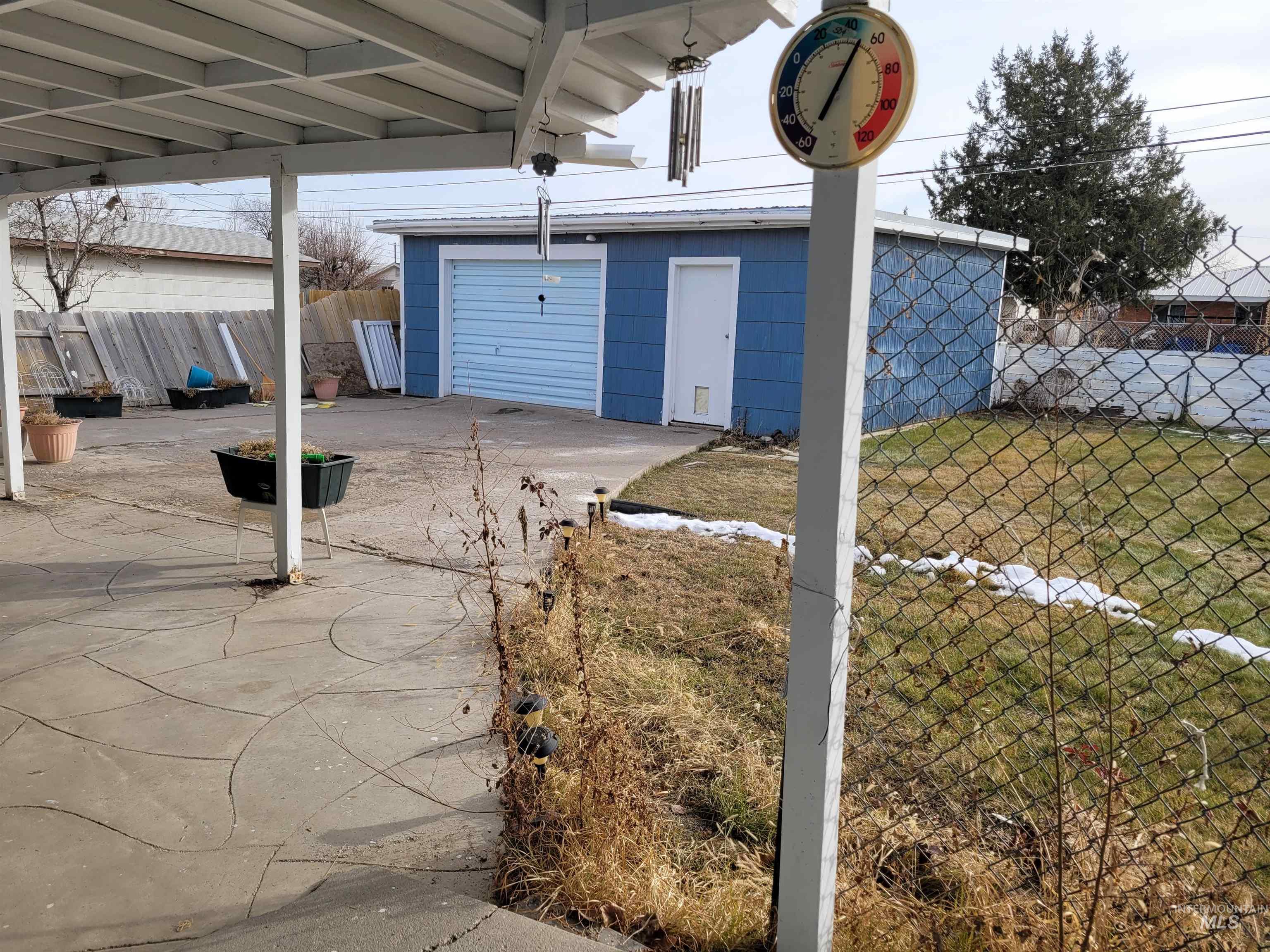 401 South 4th Street Rupert, ID 83350 - Photo 5 of 19 View of patio with an outbuilding and a garage