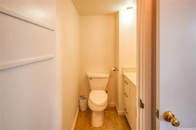 a white toilet sitting next to a shower