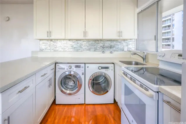 a kitchen with a sink and cabinets