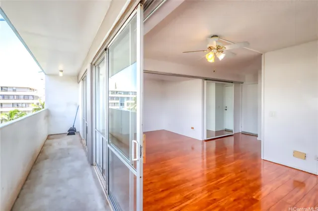 a view of a hallway view with wooden floor and staircase