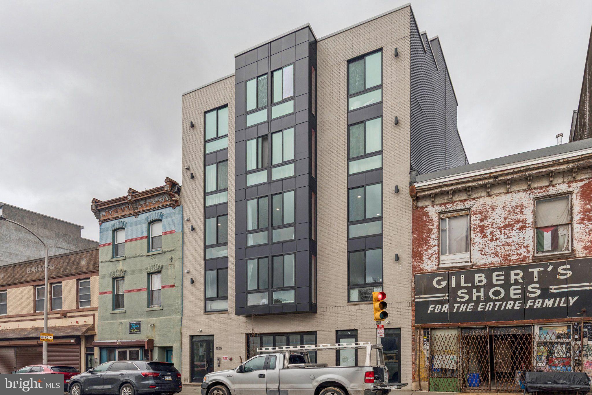 1648-50 Ridge Avenue, Unit 302 Philadelphia, PA 19130 - Photo 33 of 38 front view of an buildings and a street
