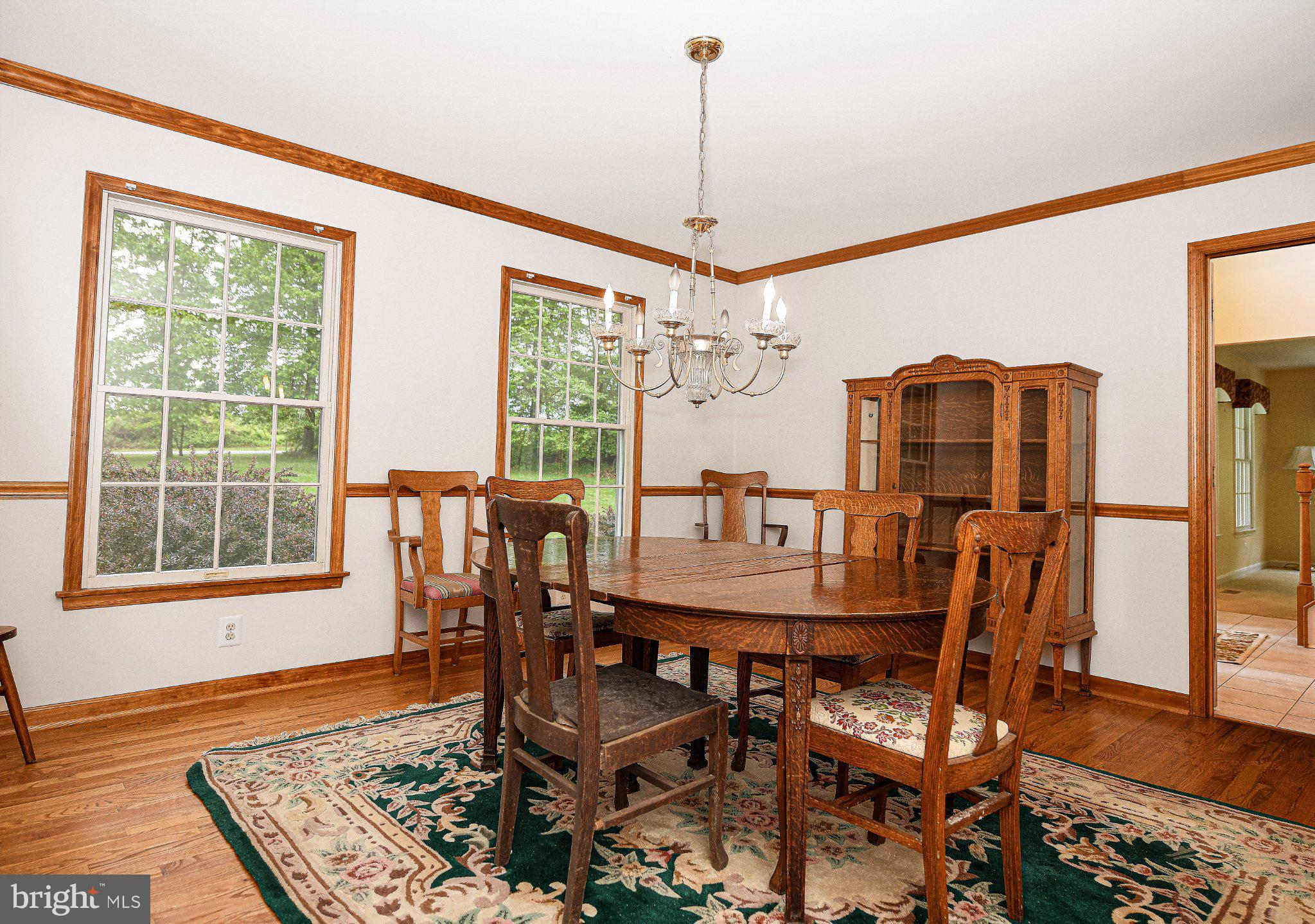 711 Gilbert Road Aberdeen, MD 21001 - Photo 8 of 54 a dining room with furniture a chandelier and wooden floor