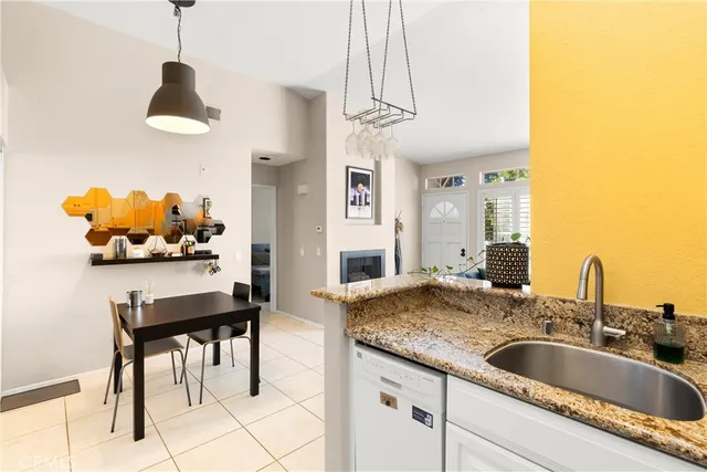 a kitchen with a table and chairs
