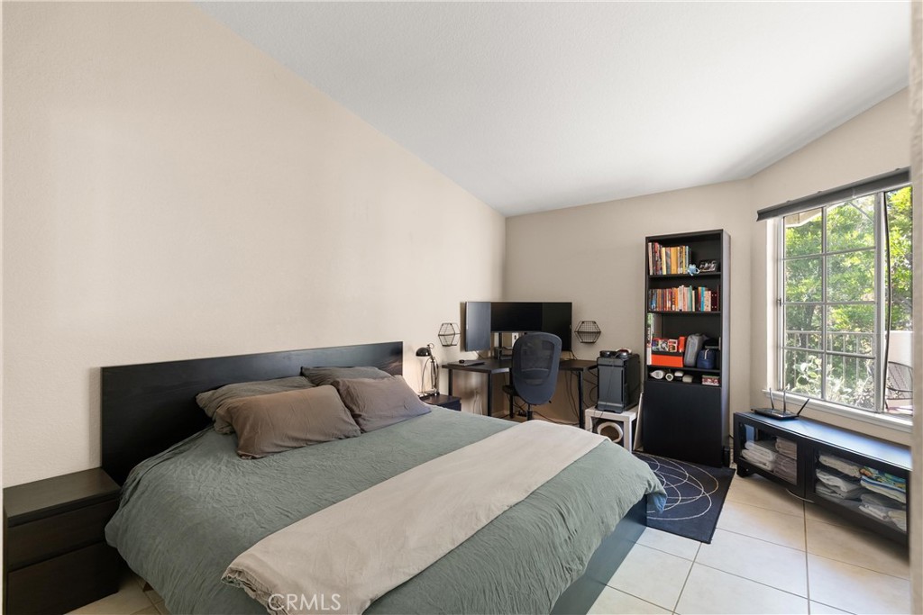 27 Castano Rancho Santa Margarita, CA 92688 - Photo 14 of 24 a bedroom with a bed and wooden floor