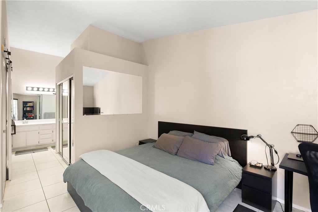 27 Castano Rancho Santa Margarita, CA 92688 - Photo 16 of 24 a bedroom with a bed and wooden floor