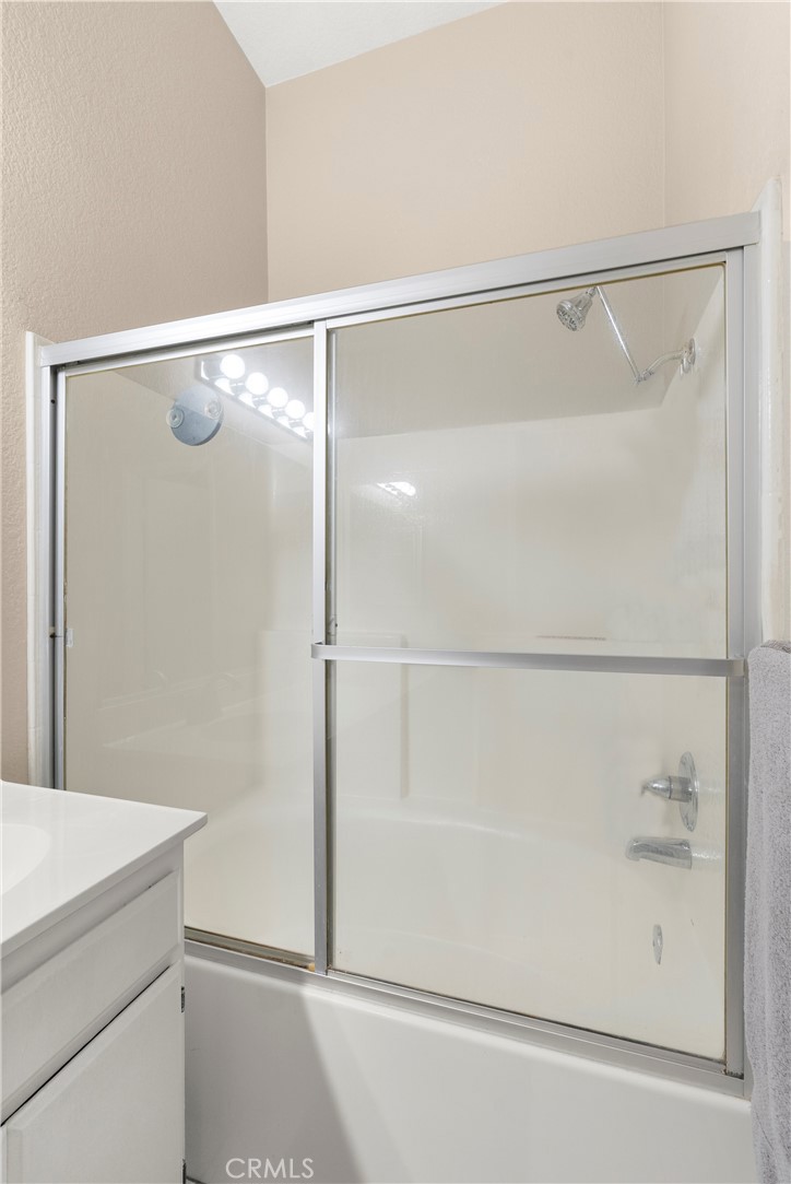 27 Castano Rancho Santa Margarita, CA 92688 - Photo 19 of 24 a bathroom with a glass shower door