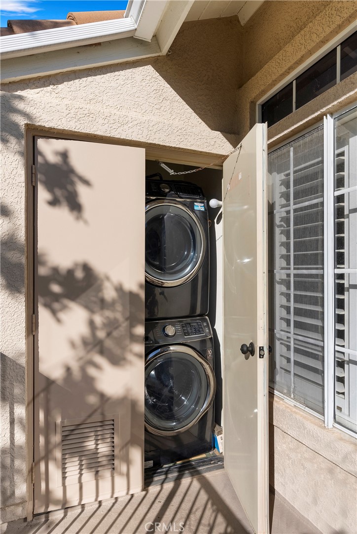27 Castano Rancho Santa Margarita, CA 92688 - Photo 20 of 24 a close view of a utility room with dryer and washer