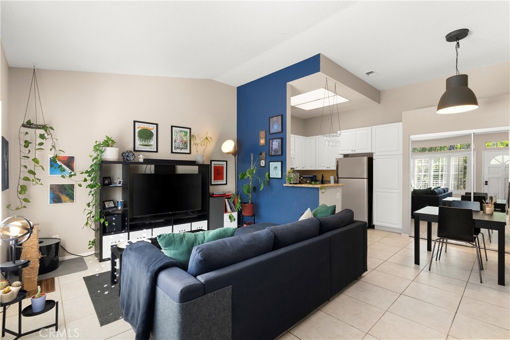 27 Castano Rancho Santa Margarita, CA 92688 - Photo 4 of 24 a living room with furniture and a flat screen tv