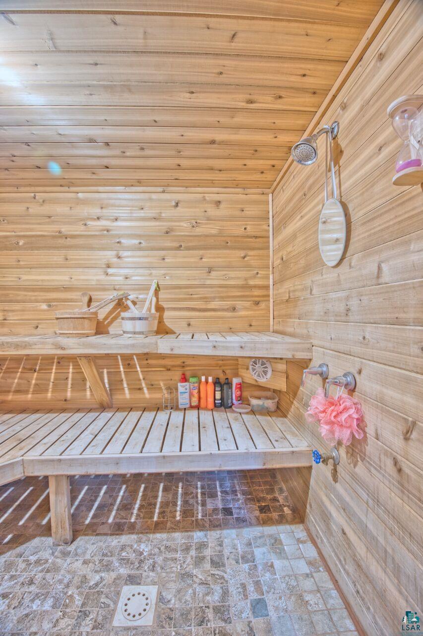 802 3rd Street Northwest Chisholm, MN 55719 - Photo 21 of 51 Relaxing sauna / steam room featuring wooden walls and wooden ceiling