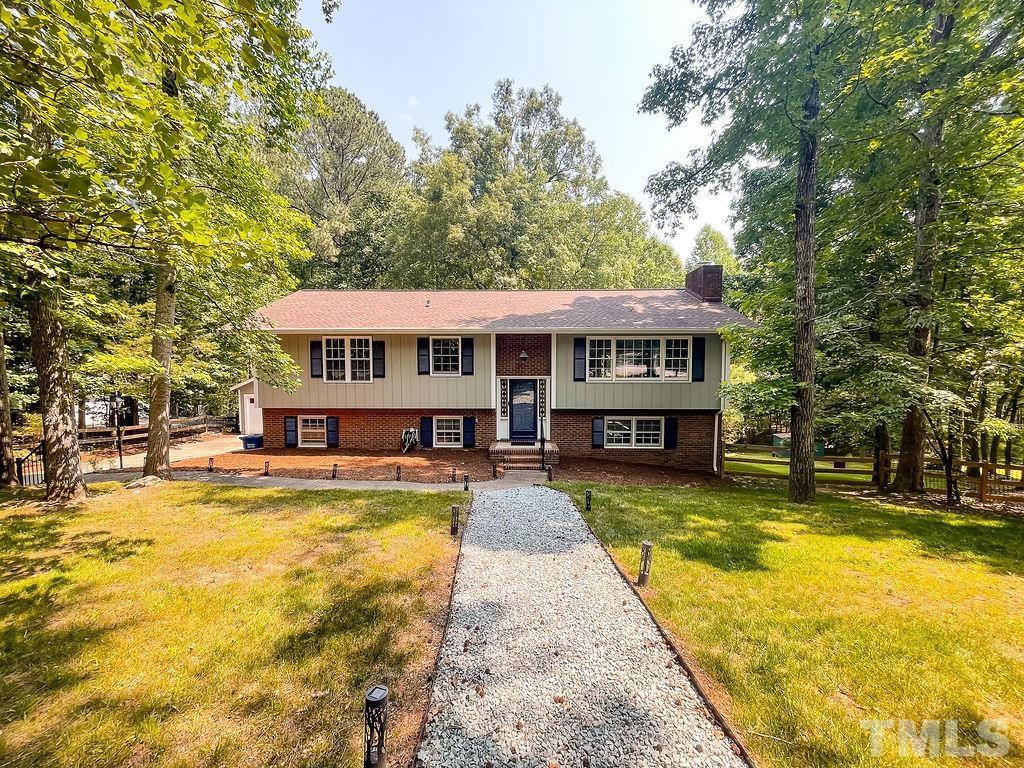 a view of a swimming pool in front of house