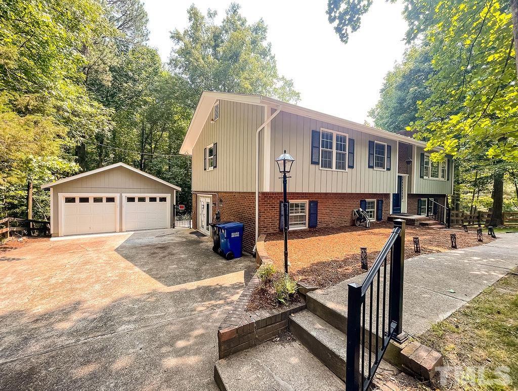 6700 Laurdane Road Raleigh, NC 27613 - Photo 2 of 25 a view of a house with a yard and sitting area