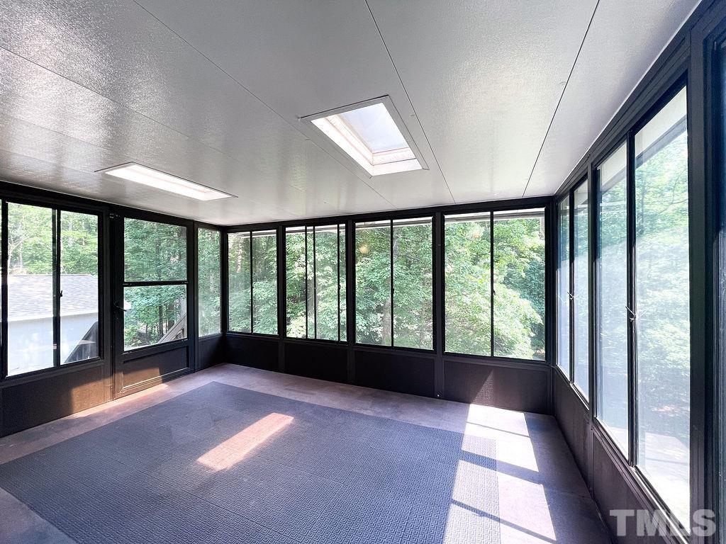 6700 Laurdane Road Raleigh, NC 27613 - Photo 22 of 25 a view of an empty room with a large window